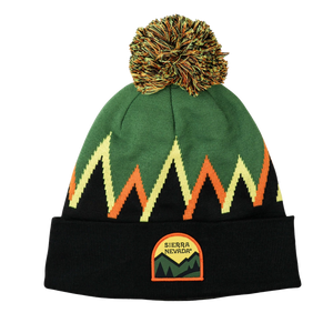 Thumbnail of Green beanie with orange and yellow patterns and a pom-pom on a white background