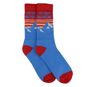 Thumbnail of Blue and red socks with mountain design and 'Sierra Nevada' text on a white background