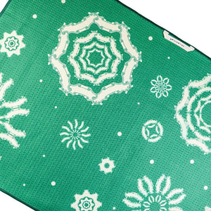 Thumbnail of Green mat with white floral patterns on a white background