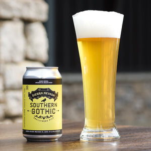 Thumbnail of Sierra Nevada Southern Gothic beer can and glass on a wooden surface with blurred stone wall background