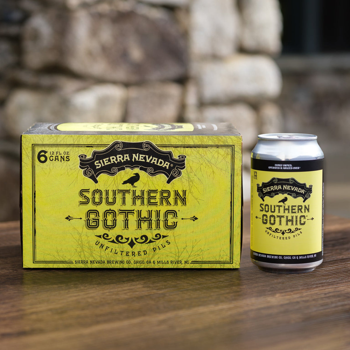 Sierra Nevada Southern Gothic beer can and box on a wooden surface with stone wall background