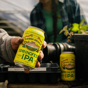 Thumbnail of Person holding a can of Sierra Nevada Springfresh IPA in an outdoor setting.