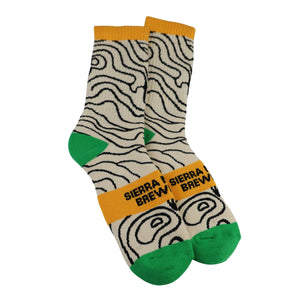 Thumbnail of Pair of socks with wavy pattern and yellow band featuring 'Sierra Brew' on a white background