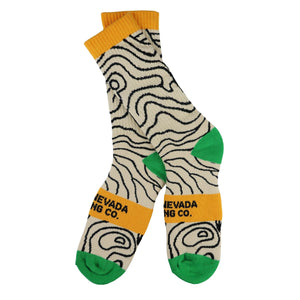 Thumbnail of Pair of socks with wavy pattern, orange accents, and 'Sierra Nevada' text on a white background.