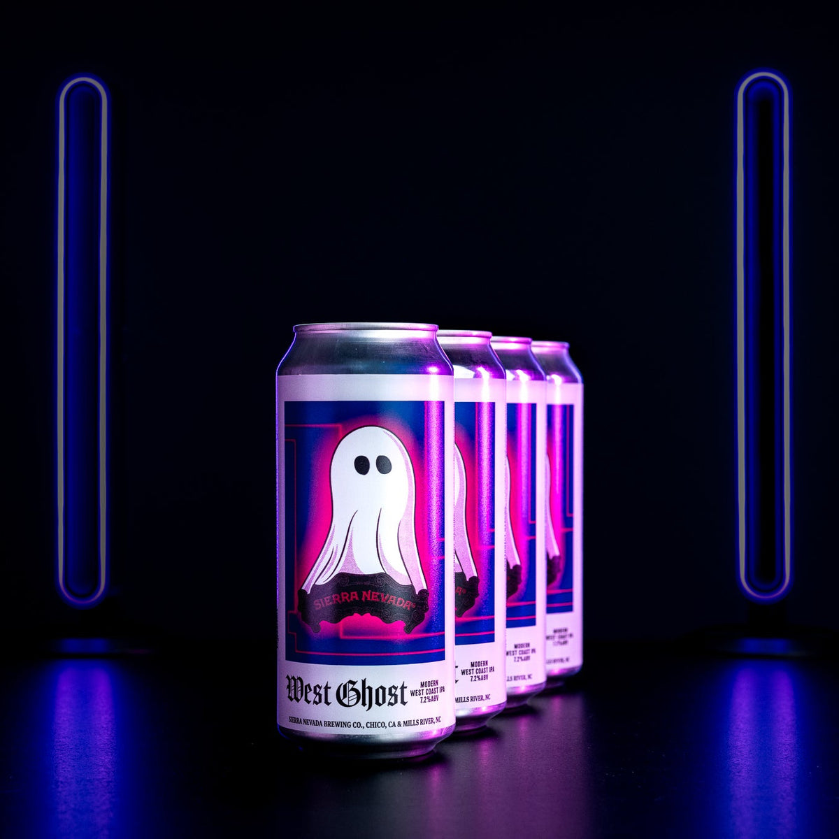Four cans of 'West Ghost' beer on a black background with purple lighting