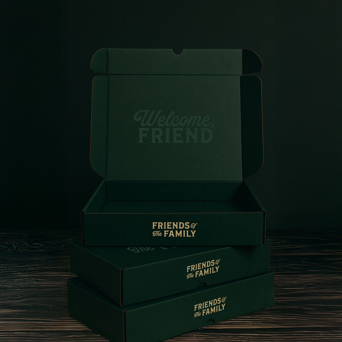Stack of green boxes with 'Friends & Family' branding on a dark background