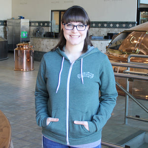 Thumbnail of Woman with brunette hair and glasses wearing the Sierra Nevada Chalk Zip hoodie