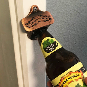 Thumbnail of Sierra Nevada wall mounted bottle opener being used to crack open a bottle of Coffee IPA