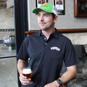 Thumbnail of Sierra Nevada Recover Polo with scroll logo worn by a man drinking a beer in a brewery