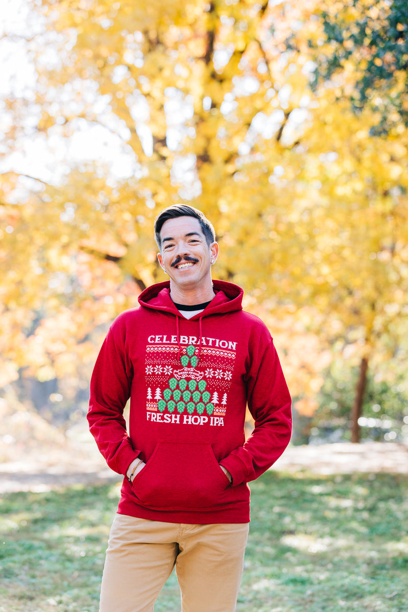 man wearing celebration hoodie outdoors