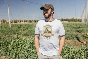 Thumbnail of Man standing in a hop yard wearing Sierra Nevada Pale Bock tee